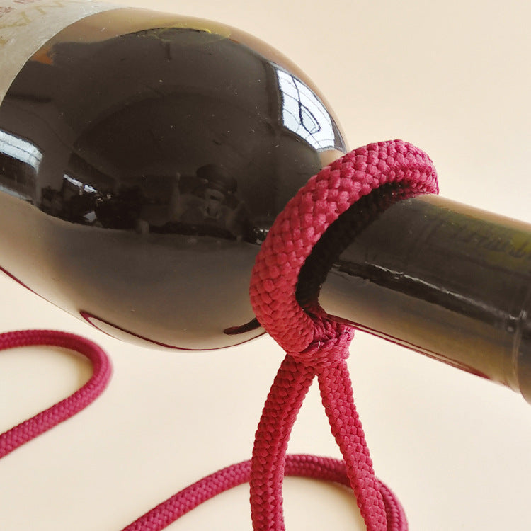 suspended rope wine bottle