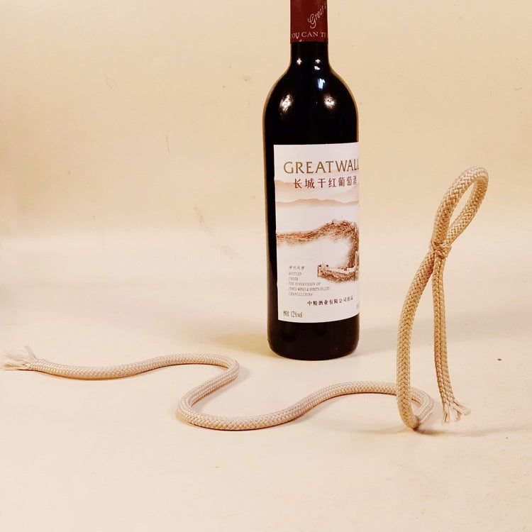 suspended rope wine bottle