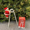Santa Claus Climbing Double Ladder