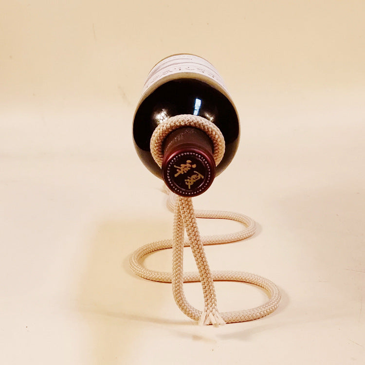 suspended rope wine bottle